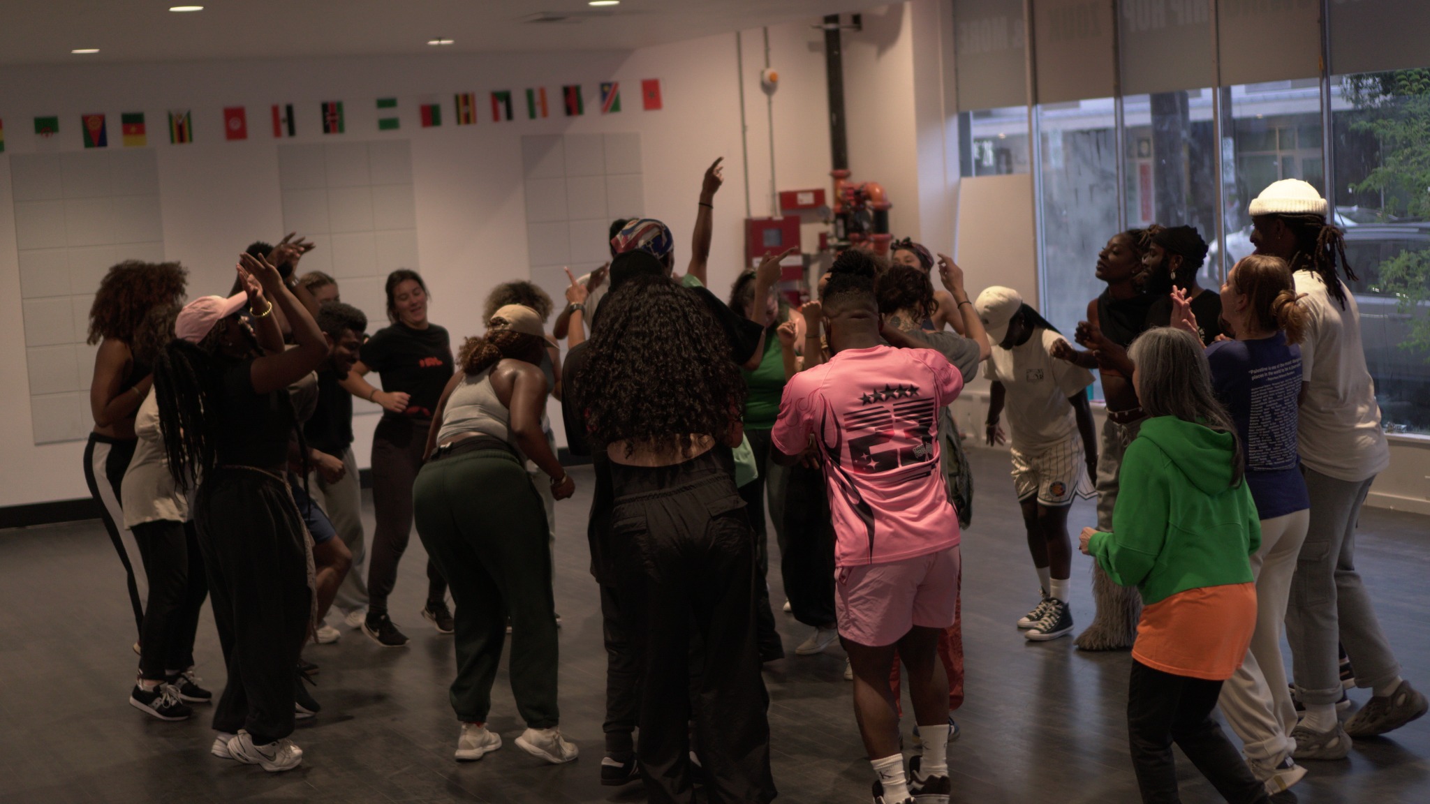 AfroDance Session participants gathered together in a studio